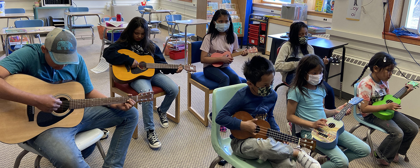 Students playing ukulele