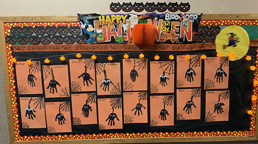 Spiders made from hands bulletin board